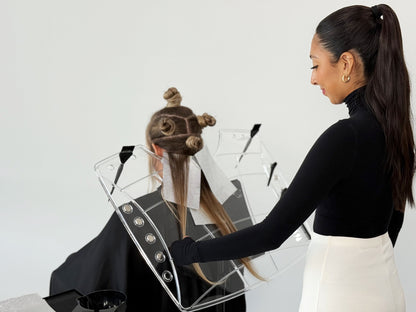 Hue-Mongous System 2.0 clear magnetic color board canvas held by model, hair stylist workstation